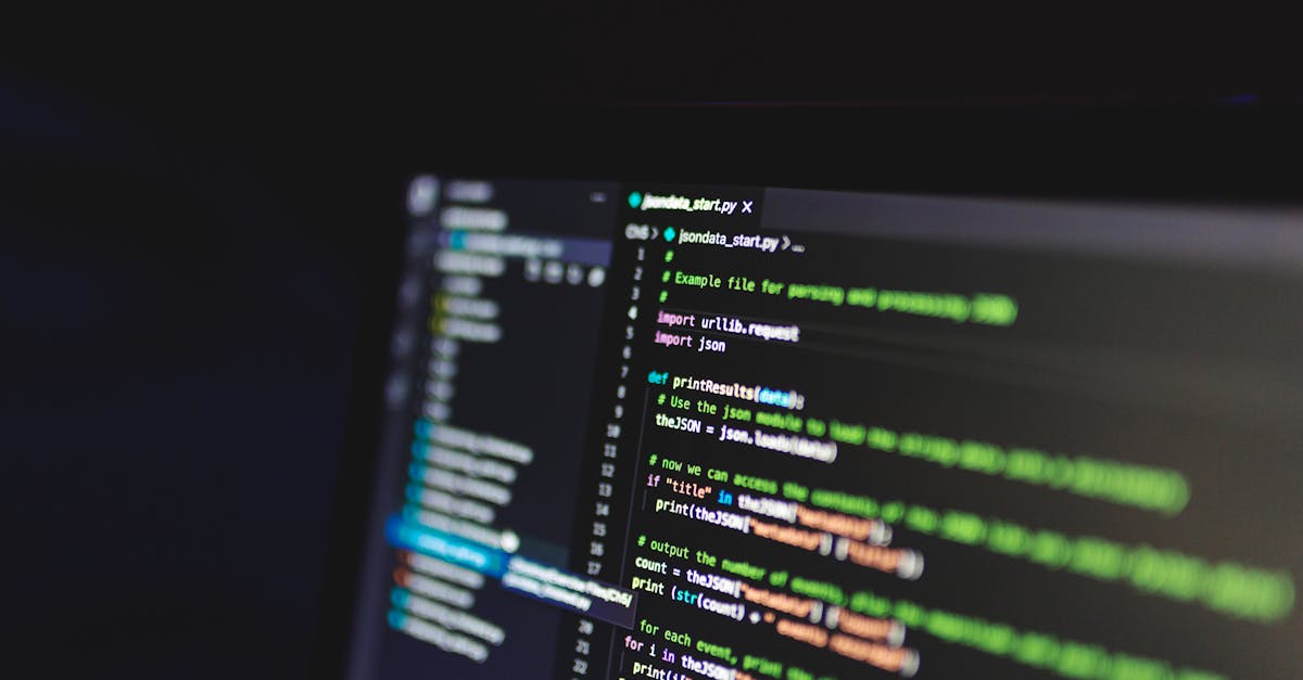 Programming code on a computer screen in a dark room, showcasing technology and IT expertise.